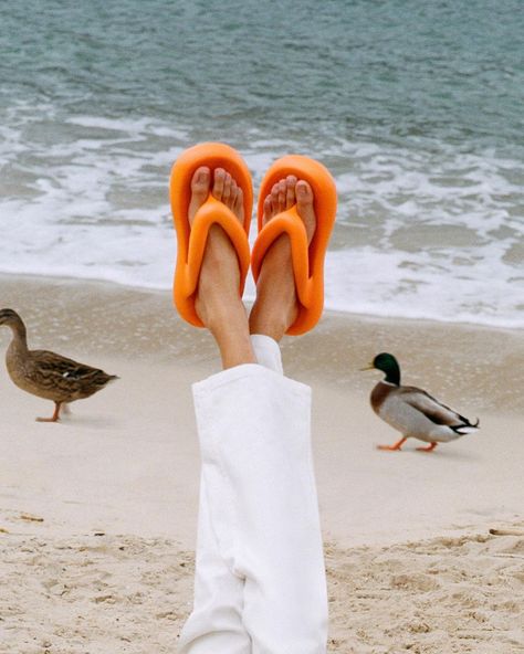 Flip Flop Outfits Summer, Orange Flip Flops For Beach Season, Flip Flop Product Photography, Sandals Photoshoot, Summer Streetwear Slide Flip Flops, Summer Orange Flat Flip Flops, Beach Flatlay, Prada Flip Flops, Orange Flip Flops