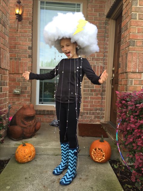 Rain Cloud Halloween Costume 2015. We attached poly fill to a novelty cowboy hat with a glue gun for the cloud. For the rain we threaded silver sequins and clear beads onto clear stretch and purple metallic threads then we hot glue those to the brim of the hat. We glued yellow construction paper to light chipboard and cut out the lightning bolt for a dash of color. Add fun galoshes and voila! Storm Halloween Costume Diy, Diy Rain Cloud, Storm Halloween Costume, Storm Halloween, Rainbow Halloween Costume, Adults Games, Halloween Mad, Cloud Costume, Rainbow Halloween