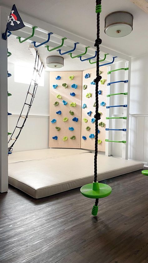 Basement Rock Wall Indoor Climbing, Basement Rock Wall, Indoor Kids Gym Playroom, Diy Sensory Gym At Home, Diy Indoor Rock Wall For Kids, Basement Sensory Gym, Fun Garage Ideas, Basement Ninja Course, Rock Wall Basement