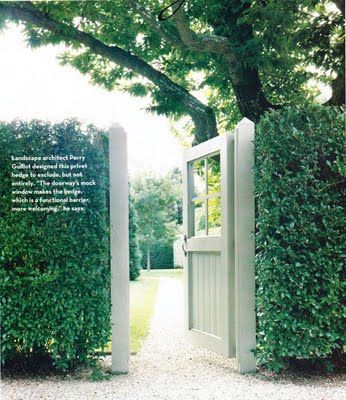 This gate mimics a front door with the windows and size. Surrounded by the privet hedge, there is no guessing where the entrance is located.  Image from House & Garden. Hedge With Gate Entrance, Boxwood Fence Front Yard, Painted Privacy Fence, Hedge Fence, Privet Hedge, Garden Gates And Fencing, Boxwood Garden, Backyard Privacy, Evergreen Plants