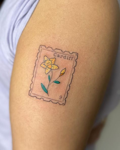 Crayon stamp tattoo to celebrate time in wales I am booking April onwards, DM TO ENQUIRE ABOUT YOUR NEXT TATTOO 💖 . . . . . . . #stamp #stamptattoo #bristol #bristoltattoo #bristoltattooartist #bristoltattoostudio #tattoo #tattoos #uktattoo #tattoouk #daffodil #fineline #finelinetattoo #finelinetattoos #colourtattoo #tattooideas #tatt #patchworktattoo . Would you get a stamp tattoo? Wales Tattoo, Postage Stamp Tattoo, Tattoo Uk, Stamp Tattoo, Scary Tattoos, Fine Line Tattoos, Next Tattoo, Postage Stamp, Color Tattoo