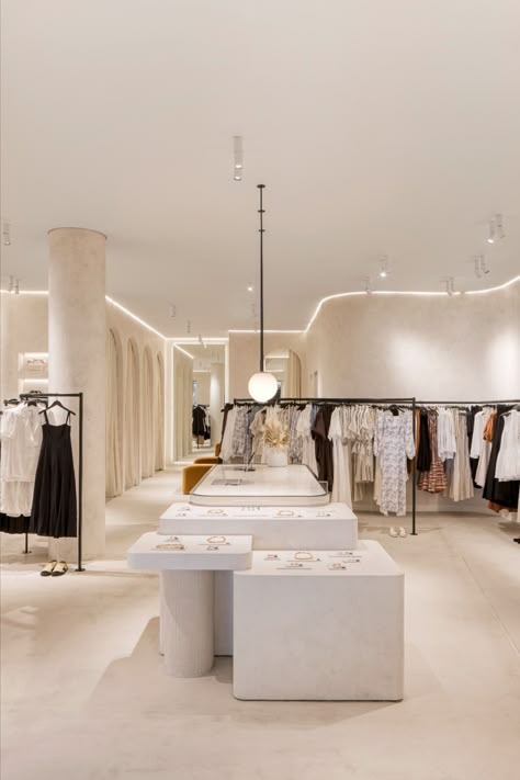 A women's clothing store, with a neutral colour palette throughout, the walls have a textured look by using french wash, and the customer island display joinery is multileveled with curved corners and tiled accents. Fashion Shop Interior, Luxury Retail Store, Fashion Store Design, Fashion Showroom, Retail Store Interior Design, Retail Interior Design, Store Design Boutique, Retail Store Interior, Showroom Interior Design