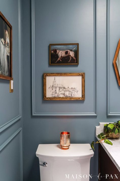 See how a 1980's standard space was transformed into a moody blue bathroom with elegant, timeless appeal. Picture Frame Molding Bathroom, Blue Powder Room Ideas, Moody Blue Bathroom, Molding Bathroom, Blue Vintage Bathroom, Blue Kitchen Paint, Blue Powder Room, Powder Bathroom Ideas, Blue Bathroom Paint