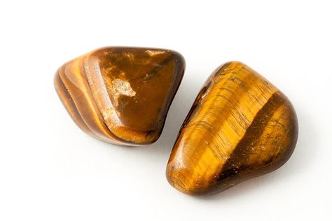 What is Tigers Eye?  Tigers Eye is a member of the Chalcedony mineral class family. It has a silky luster and an opaque transparency. Tiger’s Eye is commonly a metamorphic rock that comes in shades of reddish brown with iron stripes. The meaning of Tigers Eye is self-confidence and inner strength.   The Origins of Tigers Eye Nicknamed The Shapeshifter, the earthly rich and curious gemstone of Tiger’s Eye invites the wearer to embrace their inner-strength, personal willpower, and to call on the Tiger Eye Hair Color, Tiger Eye Hair, Sacral Chakra Stones, Eye Meaning, Brown Tiger Eye, Brown Gemstone, Tiger Eye Crystal, Tiger Eye Bracelet, Tigers Eye Gemstone