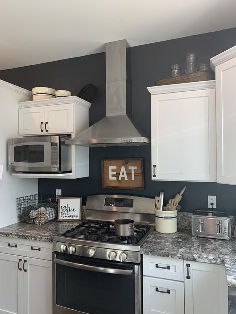 Kitchen cabinets with black appliances