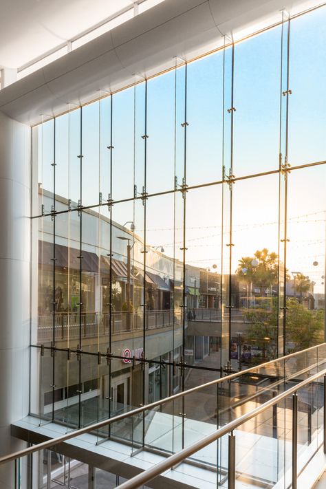 “Lifestyle” experience complete with natural light and free flowing space at Del Amo Fashion Center Mall, achieved thanks to Pilkington Planar™ structural glass fin wall - an intricate and sophisticated system of ultra-clear structural glass. | W&W Glass, LLC Glass Facade Detail, Exterior Glass Wall, Del Amo Fashion Center, Curtain Wall Detail, Glass Wall Systems, Canopy Glass, Glass Spider, Wood Facade, Architectural Materials