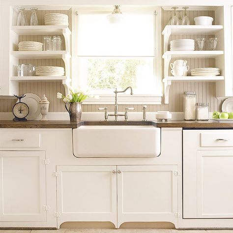 cottage style.. bead-board back splash, open shelving, apron-front sink, wood counter tops... would like this with brushed bronze faucet and hardware. Shelving In Kitchen, Kabinet Dapur, Open Kitchen Shelves, Kitchen Farmhouse, Kitchen Redo, Kitchen On A Budget, Kitchen Reno, Cottage Kitchen, White Cabinets