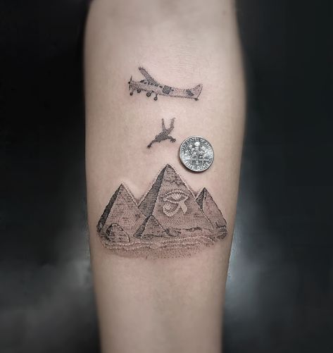 Skydiving to The Pyramids of Giza  Tattoo  Done by @themanyao Pyramid Of Giza Tattoo, 3 Pyramid Tattoo, Three Pyramids Tattoo, Pyramid Tatoos, Skydiver Tattoo, Pyramid Tattoos, Skydiving Tattoo, Luke Tattoo, Tricep Tattoo