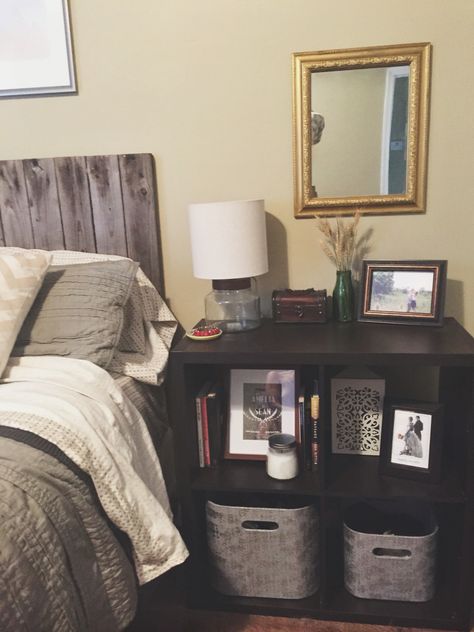 Cubes as a nightstand for extra storage. Spray painted Dollar Tree mirror. #nightstand #bedroom #storage #newlywed #mirror #gold #gray Cube Storage Decor, Ikea Cubes, Storage Hacks Bedroom, Cube Storage Shelves, Cube Shelves, Nightstand Storage, Night Stands, Night Stand, Cube Storage