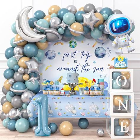 PRICES MAY VARY. First Trip Around the Sun Birthday Decorations - Package includes "ONE" box with letters, 1 backdrop, 1 tablecloth; 1 1st birthday hat, 16 cupcake toppers; 17 silver foil balloons (moon, stars, etc.), astronaut , number 1 foil balloon; 110 latex balloons (5"+10"+12"), 100 glue point dots, 5m balloon chain, 10m ribbon. Everything you need here, saving you time and money. Our set can help you throw a grand party and make wonderful memories. First Birthday Decorations for Boy - Our Kids Birthday Themes Boys, Space 1st Birthday Party, Sun Decorations, Space 1st Birthday, 1st Birthday Decorations Boy, First Birthday Theme Boy, First Birthday Decorations Boy, 1st Birthday Boy Themes, Baby Boy Birthday Themes