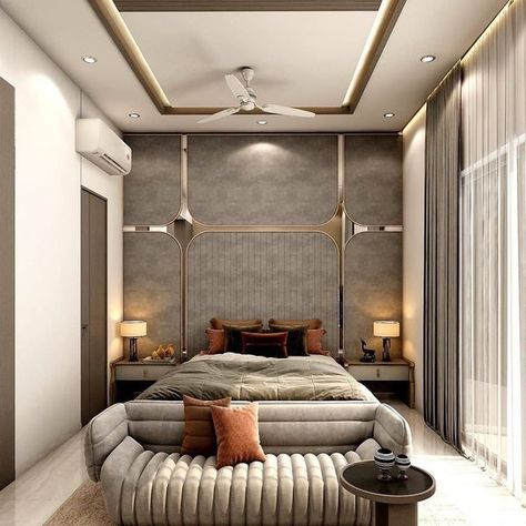 This Super Stylist bedroom with 🛏 Bed has Cushioned Couch with a ☕ Coffee Table. Bed Backwall Divided in Grid Pattern with Mirror. 📺 T.V. Unit on the Opposite Wall is Finish with Grey Laminate. Shelves on the Both Side of the T.V. is Displaying the Artifacts. Geometrical Design in Gold Colour is adding the Pattern to the Space - GharPedia Side Table With Drawers, Mirror Side Table, Holiday Bedroom, Sitting Room Design, Holiday Room, Grey Laminate, Living Room Tv Unit Designs, Geometrical Design, Table With Drawers