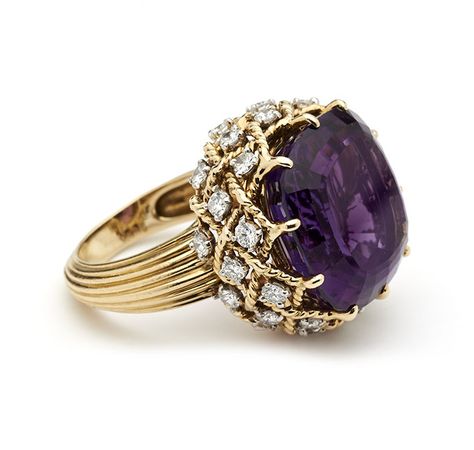 Mounted with a large amethyst in a gold rope twist gallery hung with brilliant cut diamonds, to reeded gold shank Cartier, Paris, Signed, Hallmarked and Numbered Amethyst 18mm cross Rings Purple, Cartier Accessories, Amethyst Rings, Inexpensive Jewelry, Amethyst And Diamond Ring, Purple Jewelry, Diamond Cocktail Rings, Discount Jewelry, Amethyst Jewelry