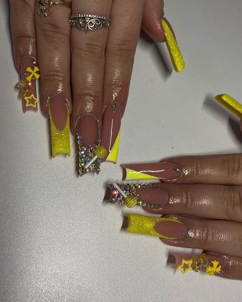 Yellow freestyle💛🌼✨ . . . Dm to book!💖 @nailed.byjennie #longnails #yellownails #blingnails #glitternails #frenchnails #nailsofinstagram #nailsoftheday #fresnonails #fresnonailtech #explorepage Y2k Nails Yellow, Yellow Junk Nails, Yellow Long Acrylic Nails, Yellow And Gold Nails Design, Yellow And Silver Nails, Black And Yellow Nails, Yellow Acrylic Nails, Acrylic Nails Yellow, Lemon Nails