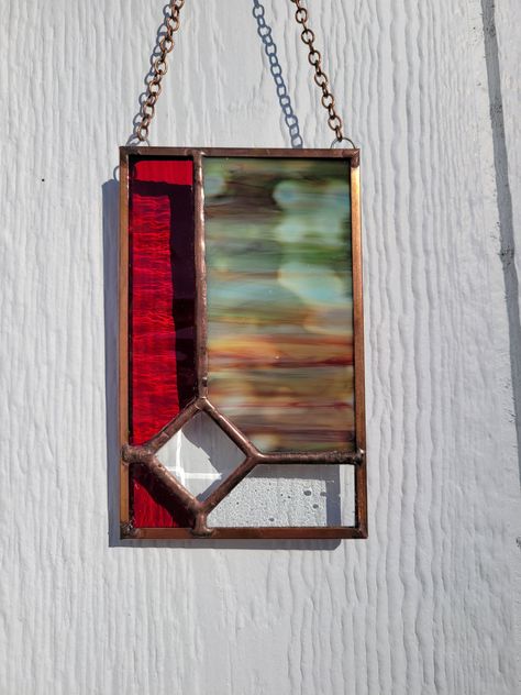 Handmade beautiful stained glass suncatcher. Consists of a deep red, red and green streaked variation, textured clear glass and a prism diamond. accented with copper edging (came) and copper patina. Measures 3" x 5" Would make a wonderful and unique gift for that special person! Abstract Stained Glass Art, Stained Glass Diy Tutorials, Celtic Stained Glass, Stained Glass Bevels, Art Deco Stained Glass, Stained Glass Gifts, L'art Du Vitrail, Stained Glass Earrings, Stained Glass Patterns Free