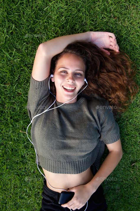 Laughing young woman lying on grass listening to music by mimagephotography. Portrait from above laughing young woman lying on grass listening to music #AD #lying, #grass, #woman, #Laughing Portrait From Above, Woman Laughing, Smile Illustration, Young Black, Music Photo, African Men, Happy Women, African Women, Young Woman