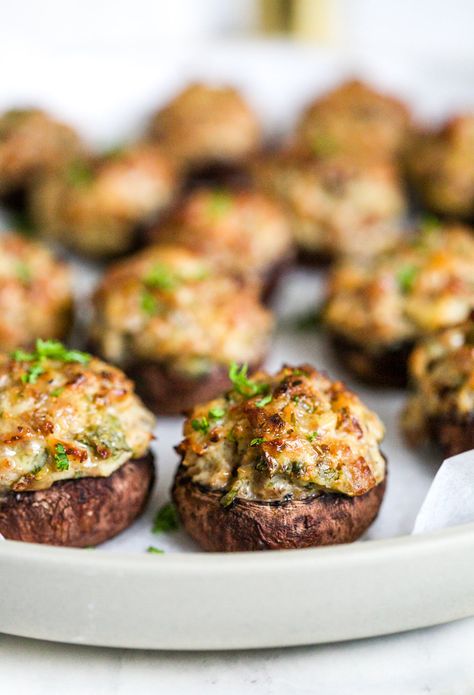 This sausage stuffed mushroom recipe makes the perfect appetizer or side dish. Scrumptious and savory, it will keep your guests satisfied until the big holiday meal is ready. I normally serve stuffed mushrooms before Christmas dinner, though they can be a deliciously unique accompaniment to your traditional Thanksgiving meal! Sausage Stuffed Mushrooms Ina Garten, Jimmy Dean Stuffed Mushrooms, Mushrooms Stuffed With Sausage, Easy Stuffed Mushrooms Sausage, Stove Top Stuffing Stuffed Mushrooms, Stuffed Mushrooms With Sausage Easy, Wild Rice Stuffed Mushrooms, Christmas Stuffed Mushrooms, Stuffed Mushroom Recipes Sausage