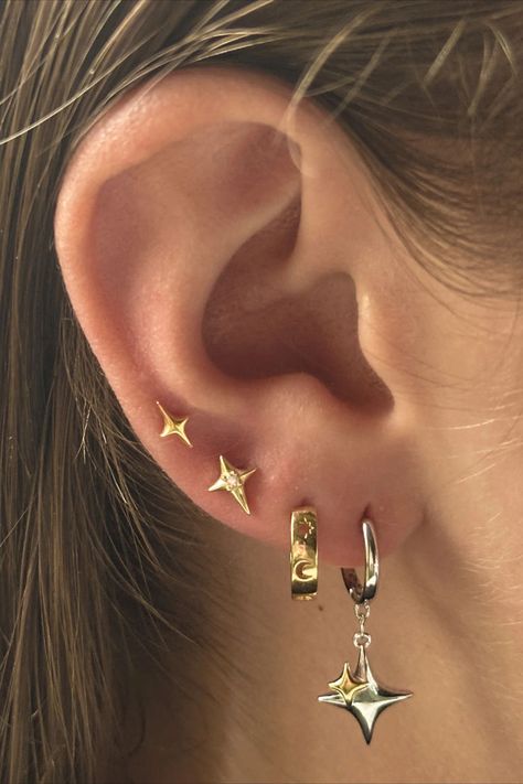 In need of a little sparkle? The Atria piercing is perfect, a small, dainty, sparkly piercing that will elevate any earring stack. Shop our matching Altair piercing as well, online now ✨#summer #piercing #stars Star Piercing, Earring Stack, Just Aesthetic, Ear Stack, Dainty Earrings, Gold Star, Gold Stars, Free Jewelry, Ear Piercings