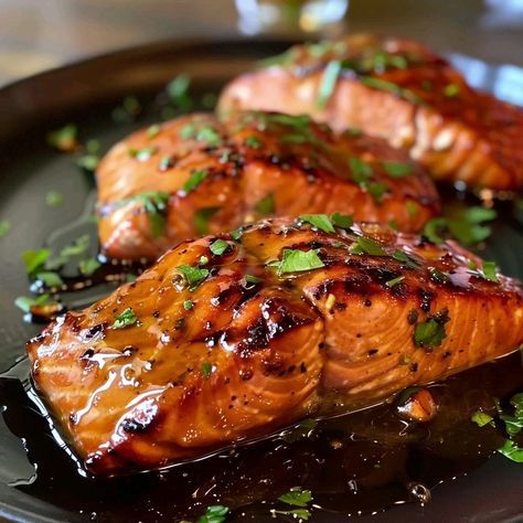 Indulge in a culinary delight with this Maple Glazed Salmon recipe. The combination of sweet maple syrup, savory soy sauce, and tangy Dijon mustard creates a glaze that perfectly complements the rich flavor of the salmon. This dish is easy to prepare and is sure to impress your family and friends. Maple Mustard Salmon, Maple Syrup Salmon, Seared Salmon Recipes, Maple Glazed Salmon, Recipes With Soy Sauce, Bbq Salmon, Maple Recipes, Salmon Glaze Recipes, Garlic Parmesan Chicken Wings