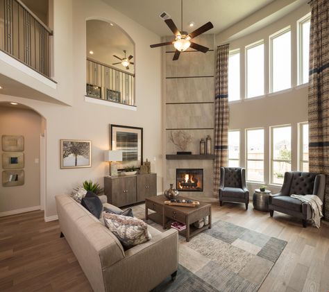 A soaring, two-story great room makes a dramatic design statement. A new home in the Camellia - Marquis community built by Legend Homes. Richmond, TX. Legend Homes, Gorgeous Homes, Foyer Decorating, Design Statement, Great Room, Nebraska Furniture Mart, White Area Rug, Luxury Villa, Nebraska