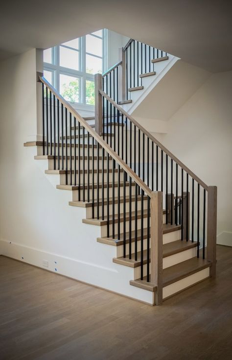 A modern railing can increase the visual appeal of your stairs and potentially the value of your home. Learn about our modern railing design process. Black Stair Railing, Case Minecraft, Indoor Railing, Metal Stair Railing, Metal Balusters, Interior Stair Railing, Modern Railing, Wrought Iron Stair Railing, Modern Stair Railing