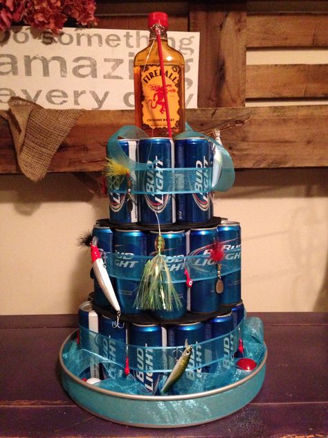 Fishing themed beer cake Beer Can Cakes, Fishing Party Decorations, Fishing Theme Birthday, Fishing Themed Birthday Party, Backyard Graduation Party, Auction Baskets, Candy Bouquet Diy, Fishing Birthday Party, Beer Cake