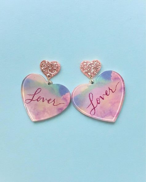 $14 LOVER ERA Earrings Get ready to make a statement with the stunning Lover Era Earrings! 2” long 1.5” in diameter Acrylic Order yours here⬇️ https://tealtigershop.com/products/lover-era-earrings?utm_content=ios&utm_medium=product-links&utm_source=copyToPasteboard 📦Ships from MS, next business day, or pick up in store at 767 Church St, Lucedale, MS. 🛍️ #loverera #earrings #boutique #boutiqueshopping #shopsmall Swiftie Party, Lover Era, Business Day, Party Outfits, Boutique Shop, Small Shop, Get Ready, Party Outfit, Ios