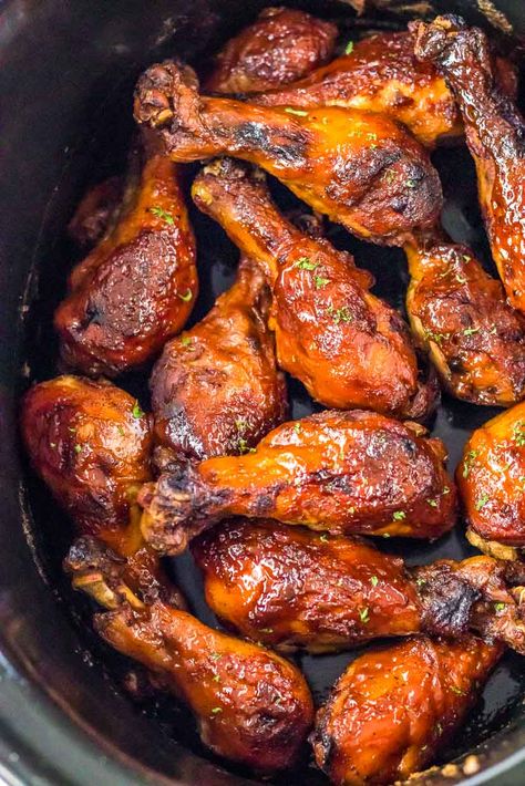 Get ready to sink your teeth into tender and flavorful slow cooker BBQ chicken legs. With minimal effort, these juicy drumsticks are coated in a tangy and smoky barbecue sauce that everyone will love. Perfect for busy days or laid-back gatherings, this easy slow cooker recipe is a crowd-pleaser that'll keep you coming back for more! Chicken Legs For A Crowd, Slowcooker Drumsticks Crock Pot, Chicken Drumsticks In Slow Cooker, Barbecue Chicken Legs In Crockpot, Crockpot Bbq Chicken Legs Easy, Chicken Legs In Slow Cooker, Slow Cook Chicken Drumsticks, Crockpot Bbq Drumsticks, Slow Cooker Bbq Chicken Drumsticks