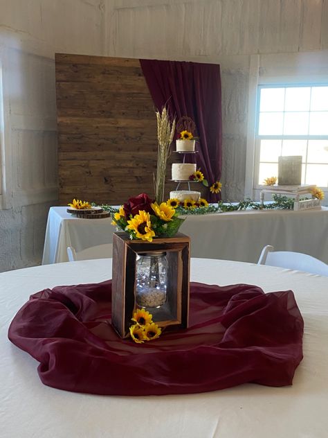 Maroon Wedding With Sunflowers, Sunflower Roses Centerpieces, Red And Yellow Wedding Centerpieces, Red Roses And Sunflower Wedding Decor, Burgundy And Sunflower Wedding Centerpieces, Rose And Sunflower Centerpiece, Sunflower And Roses Wedding Theme, Sunflower And Rose Wedding Decorations, Sunflower Rose Wedding Theme