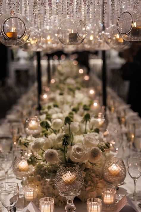 Detailed tablescape featuring white florals, glassware, and personalized touches for elegant dining. Short Wedding Table Centerpieces, Dreamy Wedding Flowers, Luxury Event Design, Modern Elegant Wedding, Youngstown Ohio, All White Wedding, Ceiling Treatments, White Florals, White Wedding Cake