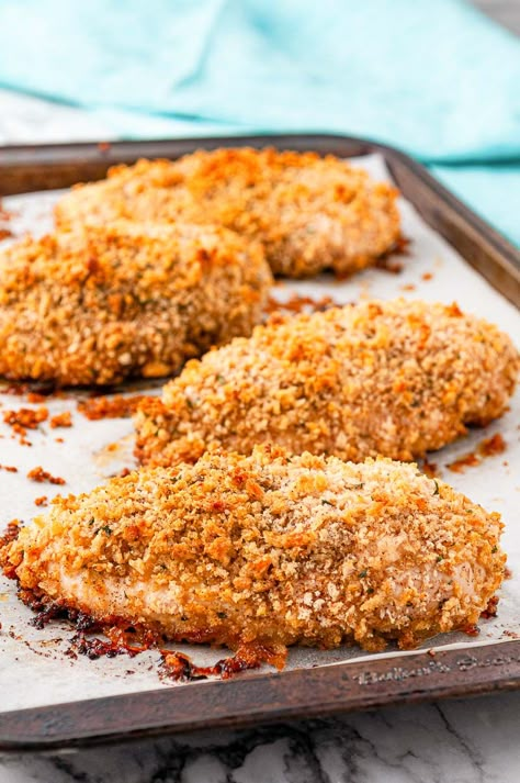 Oven Fried Chicken Breast is the healthier version of a comfort food favorite! Made with chicken breasts dredged in a spiced breadcrumb mixture, this easy recipe is light on fat but big on flavor! Oven Baked Crusted Chicken, Baked Breadcrumb Chicken, Breadcrumb Chicken Baked, Chicken Bread Crumbs Recipe, Breaded Chicken Oven Baked, Bread Crumb Chicken Breast, Oven Fried Chicken Breast Boneless, Breaded Chicken Breast Oven, Oven Baked Breaded Chicken Breast