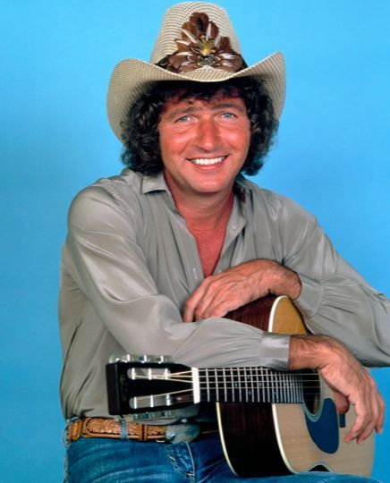 Morris Mac Davis was an American country music singer, songwriter, and actor. A native of Lubbock, Texas, he enjoyed success as a crossover artist, and during his early career he wrote for Elvis Presley, providing him with the hits "Memories", "In the Ghetto", "Don't Cry Daddy", and "A Little Less Conversation". Wikipedia Born: January 21, 1942, Lubbock, TX Died: September 29, 2020, Nashville, TN Mac Davis, Carter Family, Lubbock Texas, Celebrities Then And Now, Old Hollywood Stars, Country Music Artists, Country Music Singers, Country Stars, January 21