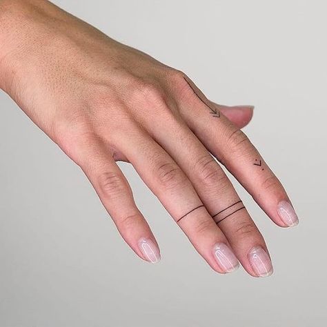 Simple line tattoos on right hand’s fingers Lines On Finger Tattoo, Finger Lines Tattoo, Line Around Finger Tattoo, Line On Finger Tattoo, Mini Finger Tattoos Simple, Simple Cute Hand Tattoos For Women, Line Tattoo On Finger, Line Tattoos On Fingers, Dot And Line Finger Tattoo