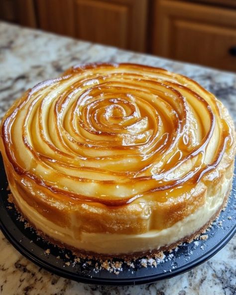 Honey Bun Cheesecake Cooking Time: 1 hour 10 minutes Calories: 450 per serving Serves: 8-10 people Ingredients: 2 (8 oz) packages cream cheese, softened 1 cup sugar 1 tsp vanilla extract 3 large eggs 1/2 cup sour cream 1/2 cup heavy cream 1 package honey buns, sliced 1 cup powdered sugar 2 tbsp milk 1/2 tsp cinnamon Instructions: Preheat oven to 325°F (163°C). Prepare the crust: Line a 9-inch springform pan with parchment paper and arrange honey bun slices to cover the bottom. Make the ch... Cinnamon Roll Honey Bun Cheesecake, Honey Bun Cheesecake, Honey Bun Cake, Honey Bun, Banana Cake Recipe, Honey Buns, Daily Recipes, Springform Pan, Rare Pictures