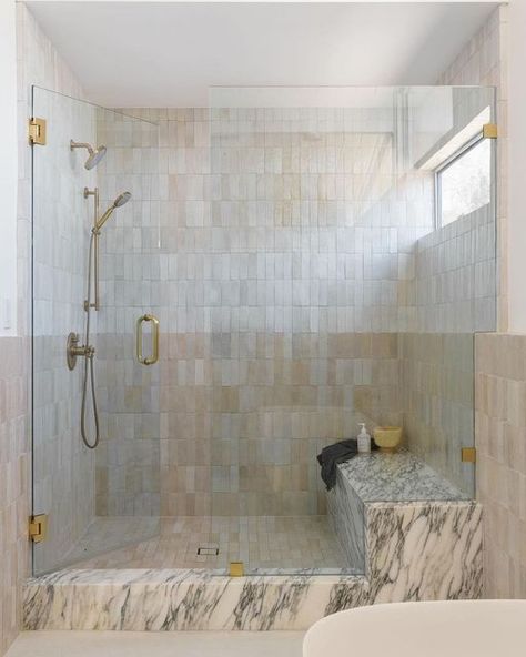 Zia Tile on Instagram: "Pure White or Casablanca? Why not both? Designer @anaberdesign stacked our two iconic zellige neutrals one over the other in this strikingly soft, two-toned shower. 📸 by @charlotteleaphotography" Zellige Tile Half Bath, Zellige Marble Bathroom, Zellige And Marble Bathroom, Zellige And Marble, Showers With Benches, Zellige Bathroom, Modern Primary Bathroom, Zellige Tile Bathroom, Walk In Shower With Bench