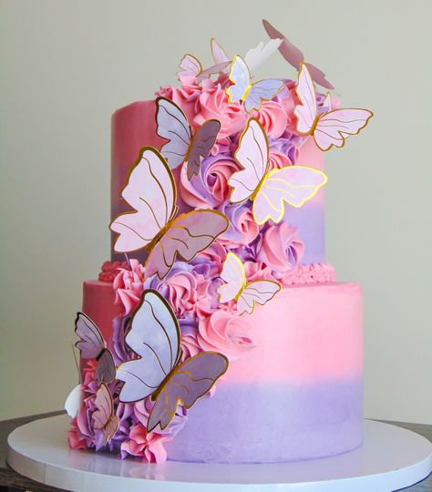 Pink and purple butterfly theme cake Pink And Purple 2 Tier Cake, 2 Tier Birthday Cake Butterfly, Purple And Gold Butterfly Birthday, 2 Tier Butterfly Cake Ideas, Pink Purple And White Cake, Encanto Two Tier Cake, Butterfly Cake Ideas 1st Birthday, Beautiful Sheet Cakes Birthday, Pastel Butterfly Cake 2 Tier