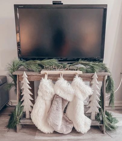 Christmas Stocking Mantle, Stocking On Tv Stand, Christmas Stockings On Tv Stand, Christmas Stocking No Fireplace, Stocking Holder Ideas No Mantle, Christmas Stocking No Mantle, Stocking Placement No Fireplace, Stocking Display No Mantle, Stocking Ideas With No Fireplace