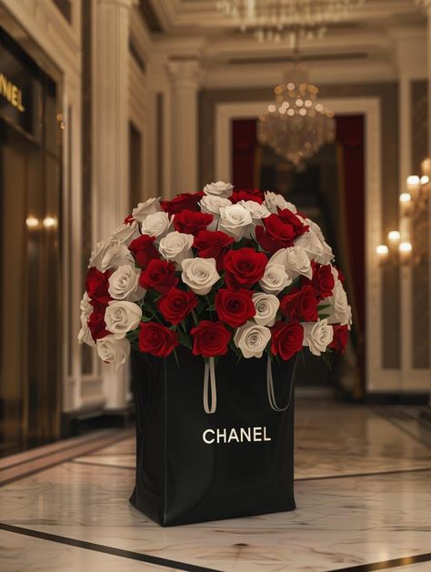 Immerse yourself in the elegance of a bouquet of red and white roses nestled in an iconic CHANEL shopping bag. The allure of luxury blooms against the backdrop of polished marble whispers sophistication. Save & follow for more moments of beauty. #LuxuryFlowers #CHANEL #EleganceInBloom #MarbleElegance #SaveAndFollow #AIImage Chanel Bouquet, Red And White Roses Bouquet, White Roses Bouquet, Chanel Shopping Bag, Chanel Shopping, Red And White Roses, Roses Bouquet, Luxury Flowers, Shop Ideas