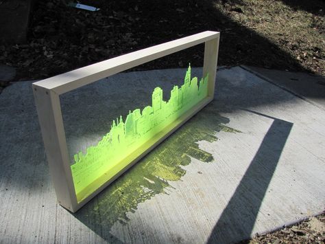 Lasercut city makes a night and day skyline Donation Box, Laser Engraved Ideas, Lazer Cut, Laser Art, 3d Laser, Laser Cut Acrylic, Laser Etching, Cnc Router, Acrylic Art