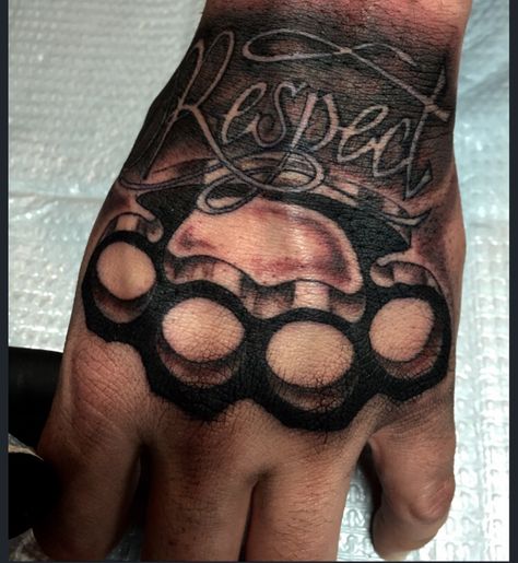 Brass knuckle hand tattoo by Audrey Mello Brass Knuckle Tattoo, Knuckles Tattoo, Knuckles Hand, Tatuaje Trash Polka, Herren Hand Tattoos, Dragon Tattoo Back Piece, Tatuagem Masculina Pequena, Brass Knuckle, Skull Hand Tattoo