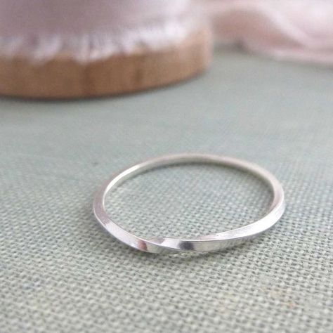 Sterling silver twist ring These are now on the website in silver and yellow gold. I could also make wider versions as special orders. My other half has been asking if I could add more twists in all the way round which I could but I quite like this minimal version what do you think? #maker #handmadejewellery #sterlingsilver #makersgonnamake #finejewellery #nikkistarkjewellery Twist Jewelry, Twisted Band Ring, Red Heart Earrings, Handmade Silver Jewellery, Silver Ring Designs, Silver Rings Simple, Twisted Band, Silver Wedding Bands, Silver Stacking Rings