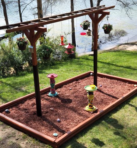 Landscape Around Bird Feeders, Multiple Bird Feeder Station, Diy Bird Feeding Station, Old Ladders Repurposed Garden, Hiding Septic Tank, Bird Feeder Landscaping, Bird Garden Ideas, Landscaping Farmhouse, Bird Feeder Station Ideas