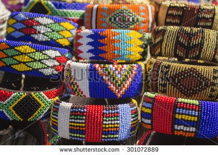 Local craft market in South Africa. Unique handmade colorful beads  bracelets, bangles. Craftsmanship. African fashion. Traditional ornament, accessories. - stock photo South African Jewelry, African Bangles, Colorful Bead Bracelets, African Crafts, Traditional Ornaments, Africa Art, Handmade Bangles, Craft Markets, Bead Bangles