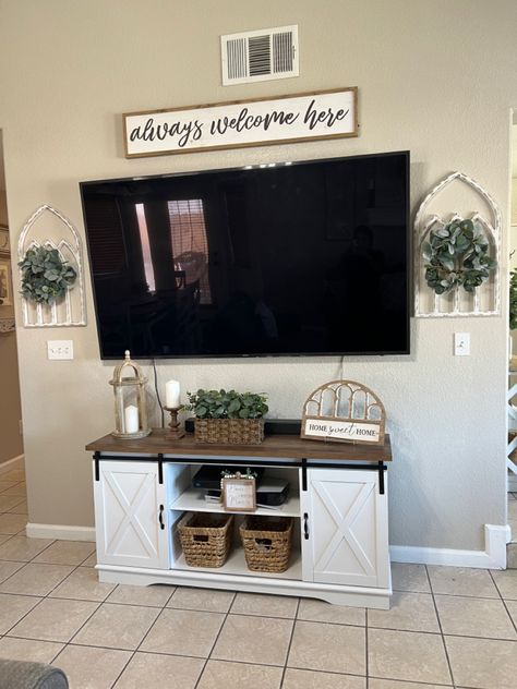 Above Mounted Tv Decor, Farmhouse Around Tv Decor, Farmhouse Tv Wall Design Ideas, Under The Tv Decor, How To Decorate Under A Mounted Tv, Tv Display Ideas, Above The Tv Wall Decor, Farmhouse Living Room Tv Wall, Western Boho Tv Stand Decor