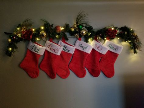 Just wanted to share for anyone needing ideas. I just used 2 command hooks, a round curtain rod and some garland. All done and no new holes in my wall! Hanging Christmas Stockings On Wall, Christmas Socks Wall, Christmas Stocking On Wall Ideas, Stockings Christmas Hanging, Stocking Wall Ideas, Creative Ways To Hang Christmas Stocking, Stocking On Wall Ideas, Hanging Stockings On Wall, Stocking Hanging Ideas