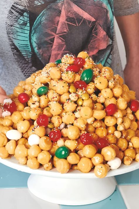 This delightful Giada's Struffoli is prepared using all-purpose flour, honey, hazelnuts, eggs, and unsalted butter. This sweet and crispy dessert takes about Sicilian Desserts, Struffoli Recipe, Italian Treats, Italian Holiday Cookies, Giada At Home, Giada De Laurentiis Recipes, Italian Baking, Giada Recipes, Holiday Baking List