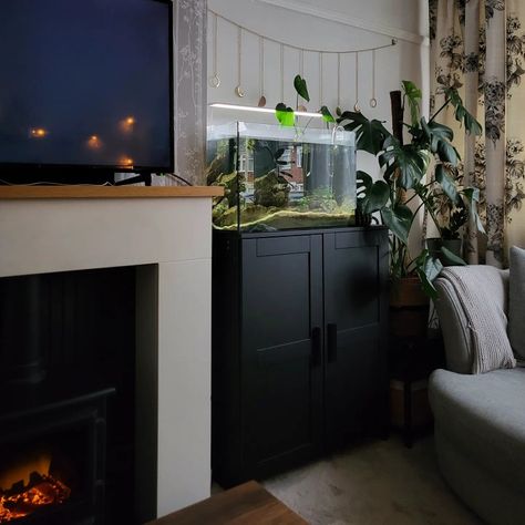 Boho industrial living room inspo fireplace log burner cosy autumn fall Living Room With Fish Tank, Fish Tank Home Decor Living Rooms, Bedroom Ideas With Fish Tanks, Fireplace Fish Tank, Living Room Fish Tank, Bedroom With Fish Tank, Fish Tank Living Room, Fish Tank In Living Room, Aesthetic Room With Fish Tank