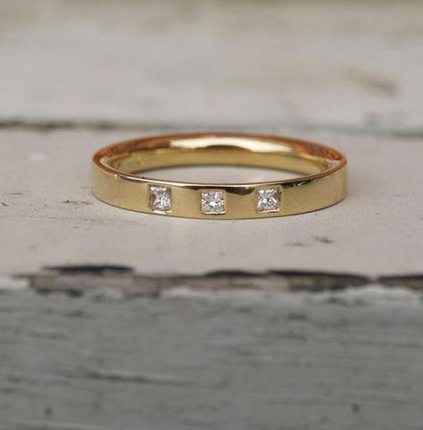 18ct recycled yellow gold band  flush set with three princess cut square diamonds. A princess cut half eternity band.Each diamond is 1.5mm square , 0.07ct total and the gold band is 2.5mm wide. If you would prefer a wider band or one in a different metal just ask for a quote.Made to order in your size, orders take 3-4 weeks.For other eternity and diamond bands go towww.karenjohnsondesign.etsy.comor facebook.com/karenjohnsondesign Diamond Gold Band, Thick Wedding Bands, Flush Set Diamond, Garnet Ring Silver, Amethyst Ring Engagement, Topaz Engagement Ring, Opal Ring Gold, Rose Gold Diamond Ring, Best Engagement Rings