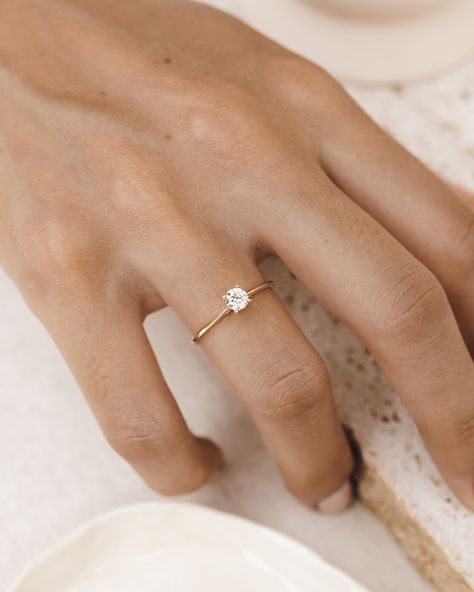 Linjer's Diamond Solitaire Ring showcases a hand-set, classic round diamond (0.25ct) on a 14k solid gold band. Solitaire rings feature one dazzling stone on a band. Diamond solitaire rings are a popular choice to serve as engagement rings. But hey, we're all about self-love, too, and there's never a need for a special occasion to celebrate yourself! Specifications:  4mm round diamond in a prong setting Total carat weight of diamond: 0.25ct 14k solid gold band Luxury Engagement Ring, Small Engagement Rings, Dainty Engagement, Luxury Engagement Rings, Dainty Engagement Rings, Cute Engagement Rings, Future Engagement Rings, Solitaire Rings, Engagement Ring For Women