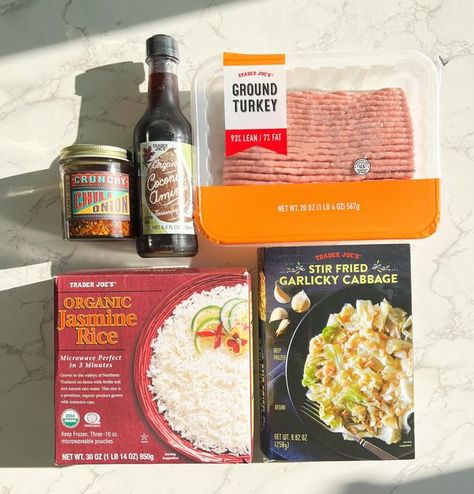 Anna Lisa | Trader Joes 5 Items or Less Recipes on Instagram: "Make this easy and healthy 5 Ingredient Trader Joe’s meal done in 20 min! Serves 3-4 Ingredients Ground turkey 1/4 cup Coconut Aminos 1 package Garlicky Cabbage Frozen Jasmine rice Crunchy chili onion Garnish w green onion (optional) Cook the ground turkey for 10 min, then add 1/4 cup coconut aminos and cook for 5 min longer while you microwave the garlicky cabbage. Then stir in the cabbage and heat for 1-2 minutes together. Serve over the Jasmine rice, add desired amount of crunchy chili onion, top w some sliced green onions and enjoy! Tag a friend who should try this easy meal! #traderjoes5itemsorless #traderjoesmeals #traderjoesideas #traderjoeshoes #traderjoesislife #traderjoesfood #traderjoeslife #traderjoesobsessed Trader Joe’s Stir Fry, Trader Joe’s Garlicky Cabbage, Trader Joe’s 5 Items Or Less, Crunchy Chili Onion Trader Joes Recipes, Easy Trader Joe’s Meals, Trader Joe’s Lunch Ideas, Trader Joe’s Recipes, Garlicky Cabbage, Trader Joe’s Meals