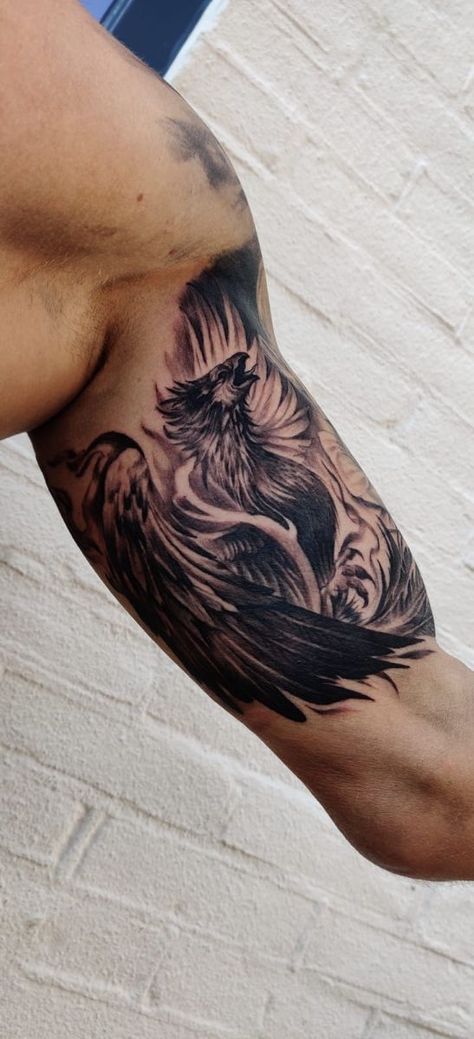 Phoenix tattoo bicep Phoenix Tattoo Men Bicep, Phoenix Tattoo Bicep, Dragon Inner Bicep Tattoo, Phoenix Bicep Tattoo, Dragon Bicep Tattoo Men, Biceps Tattoo Men, Mens Bicep Tattoo Ideas, Inner Bicep Tattoo Men Ideas Design, Biceps Tattoos For Men